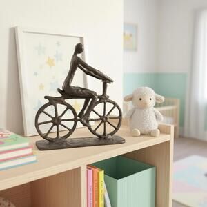 Brutalist Cast Iron Figure Riding Bicycle